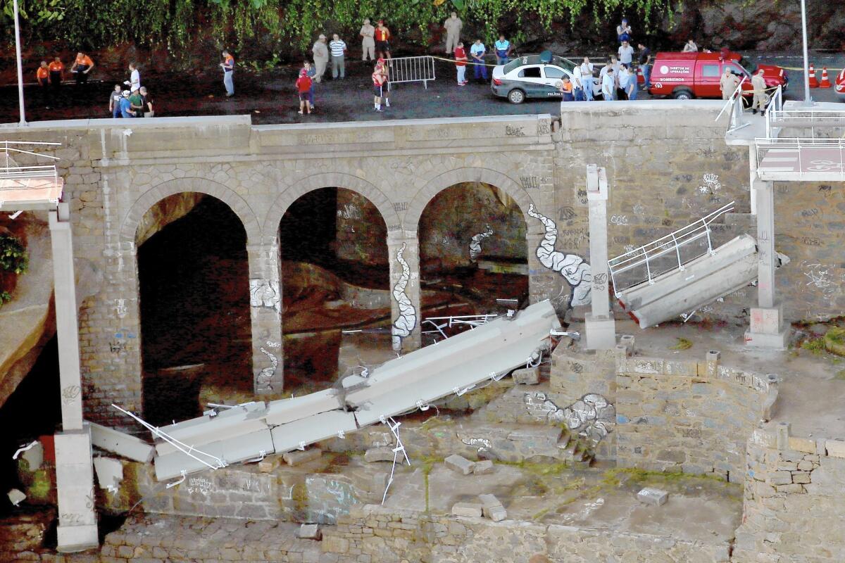 An elevated bike path built in anticipation of the Olympic Games this summer collapsed in Rio de Janeiro, killing two.