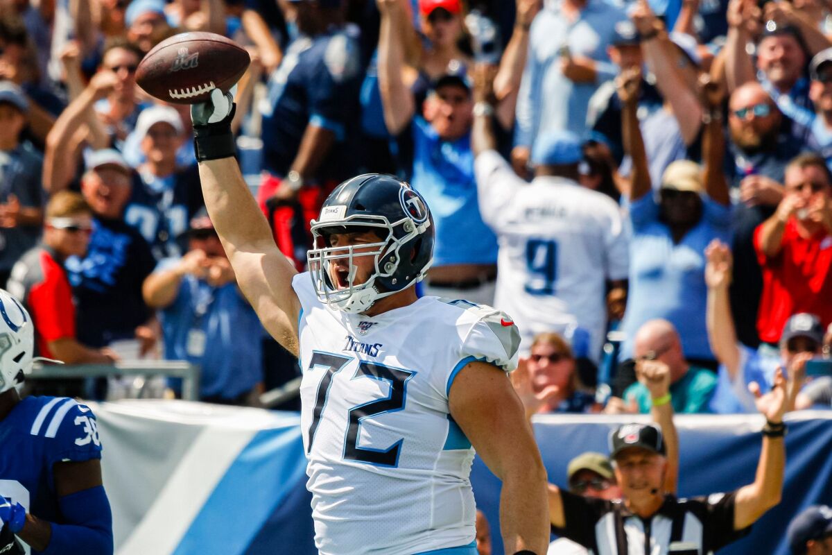 Tennessee Titans offensive tackle David Quessenberry celebrates after catching a touchdown against the Indianapolis Colts in the first half in Nashville on Sunday.