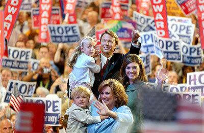 Sen. John Edwards acknowledges the crowd after his convention speech. His daughter Cate, right, introduced her mother, Elizabeth, who in turn introduced Edwards. With them are the couples other daughter, Emma Claire, and son Jack.