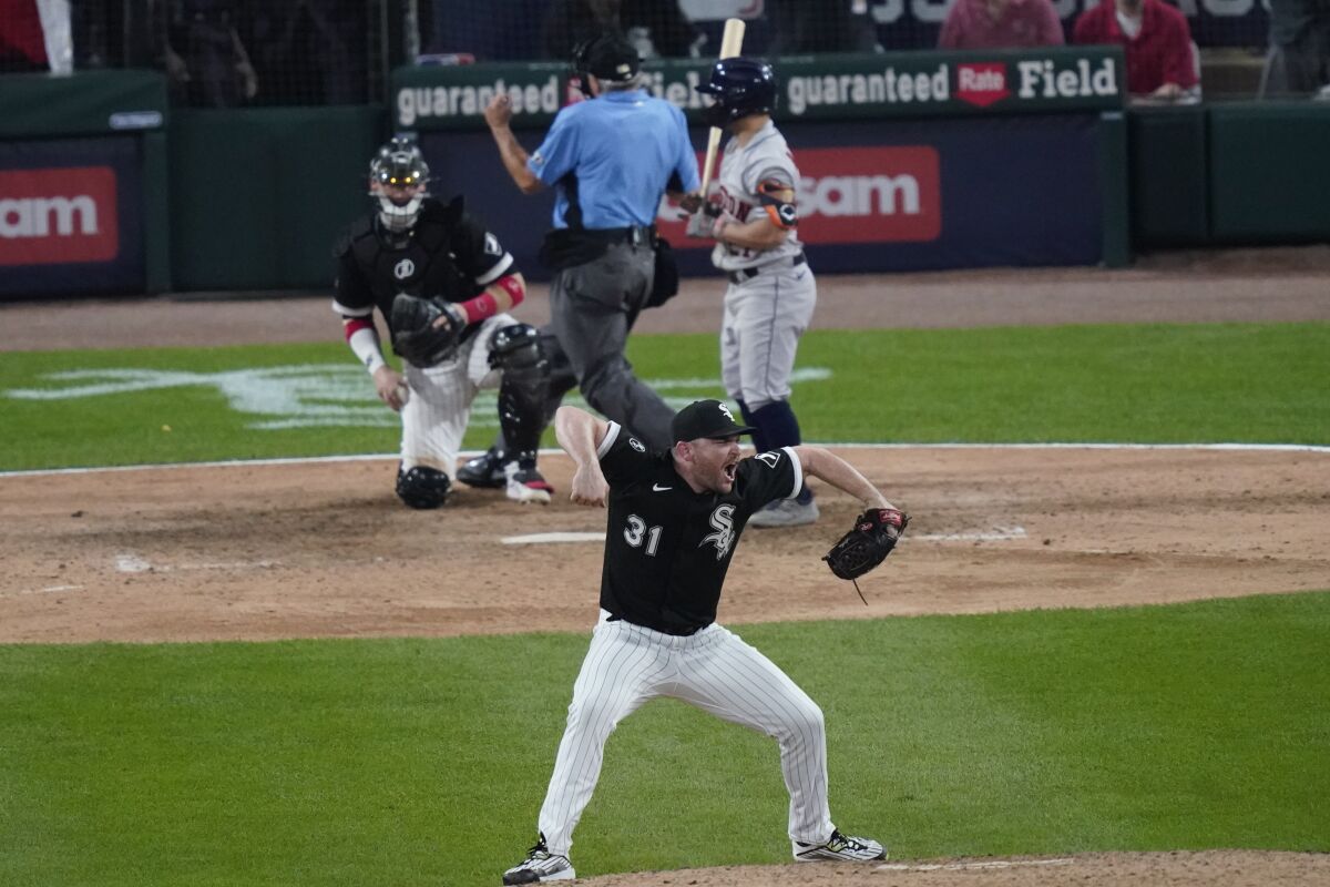 Chicago White Sox relief pitcher Liam Hendriks reacts to the final out against the Houston Astros in the ninth inning during Game 3 of a baseball American League Division Series Sunday, Oct. 10, 2021, in Chicago. (AP Photo/Charles Rex Arbogast)