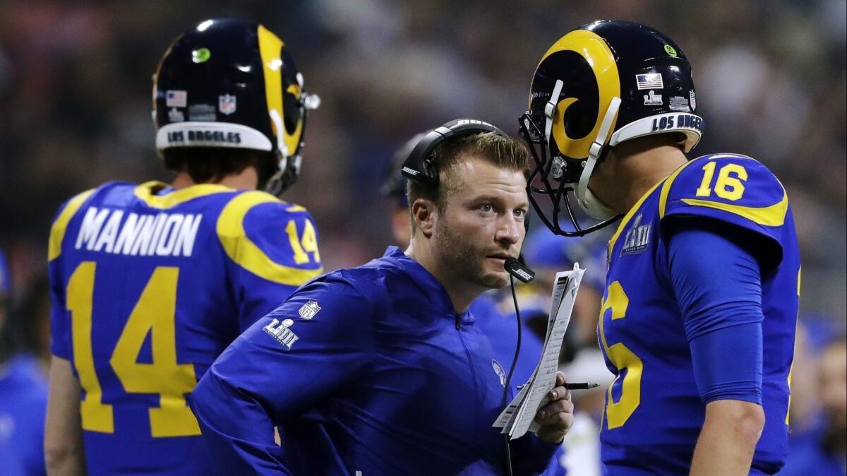 Rams head coach Sean McVay, center, speaks to Jared Goff (16) on the sideline during the second half of Super Bowl 53 against the New England Patriots on Feb. 3, 2019, in Atlanta.