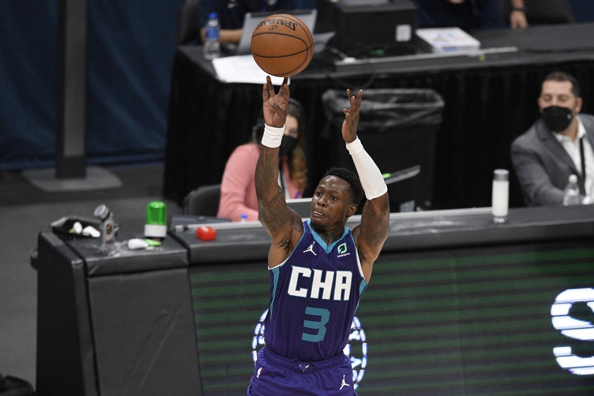 Charlotte Hornets guard Terry Rozier (3) shoots during the second half of an NBA basketball game against the Washington Wizards, Sunday, May 16, 2021, in Washington. (AP Photo/Nick Wass)