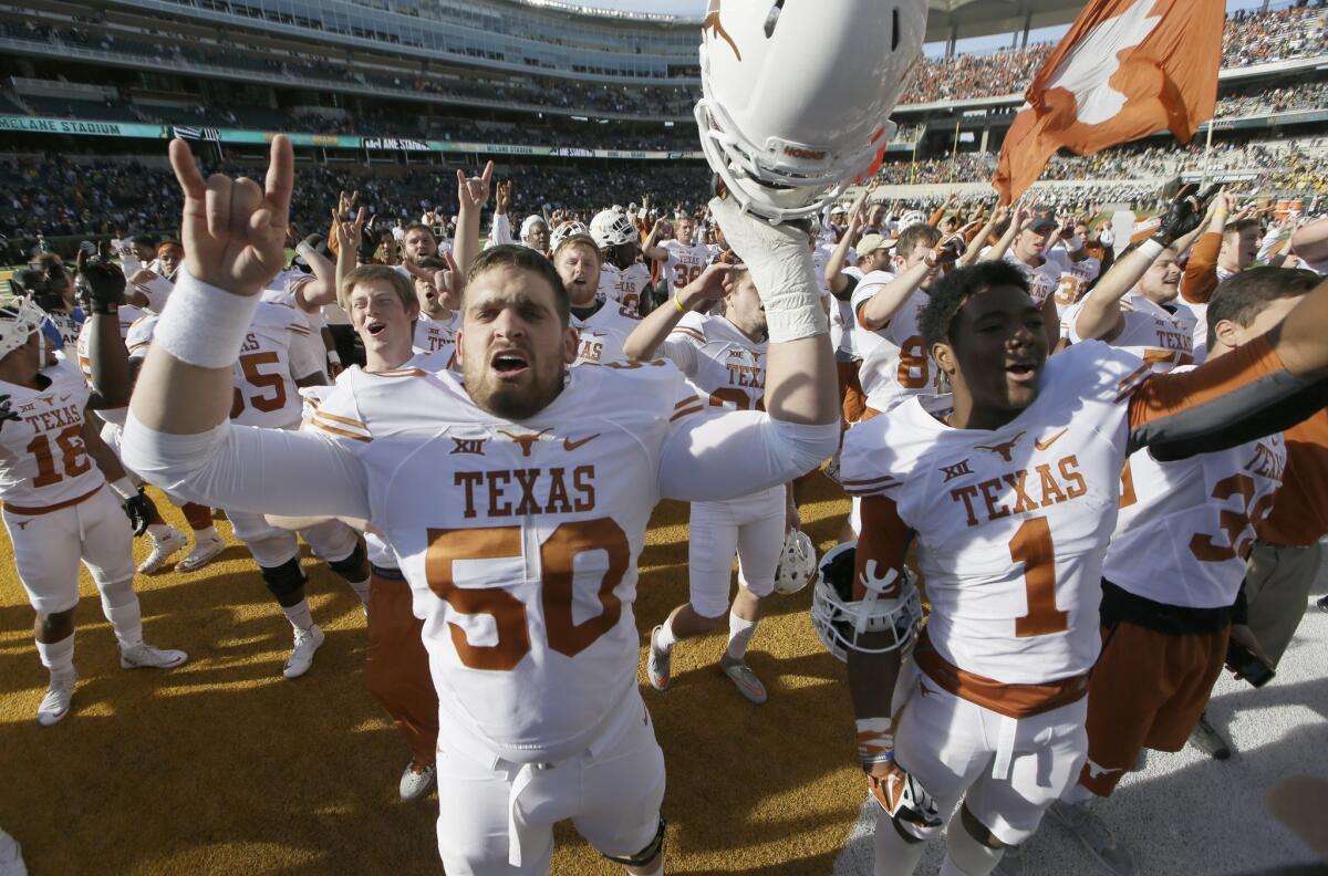Texas offensive lineman Jake Raulerson celebrates after a game against Baylor on Dec. 5.
