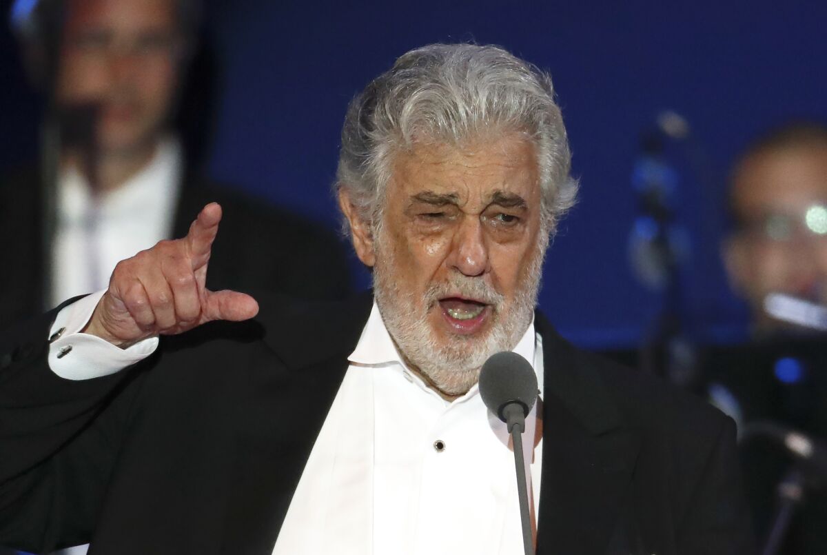 FILE - In this Aug. 28, 2019, file photo, opera singer Placido Domingo performs during a concert in Szeged, Hungary. Domingo is back in Europe to receive a lifetime achievement award after recovering from the coronavirus, vowing in an interview with a top Italian daily newspaper to clear his name from allegations of sexual misconduct. The opera legend’s appearance Thursday, Aug. 6, 2020, to accept the award from the Austria Music Theater will be his first in public since recovering from the virus at his home in Acapulco, Mexico. (AP Photo/Laszlo Balogh, File)