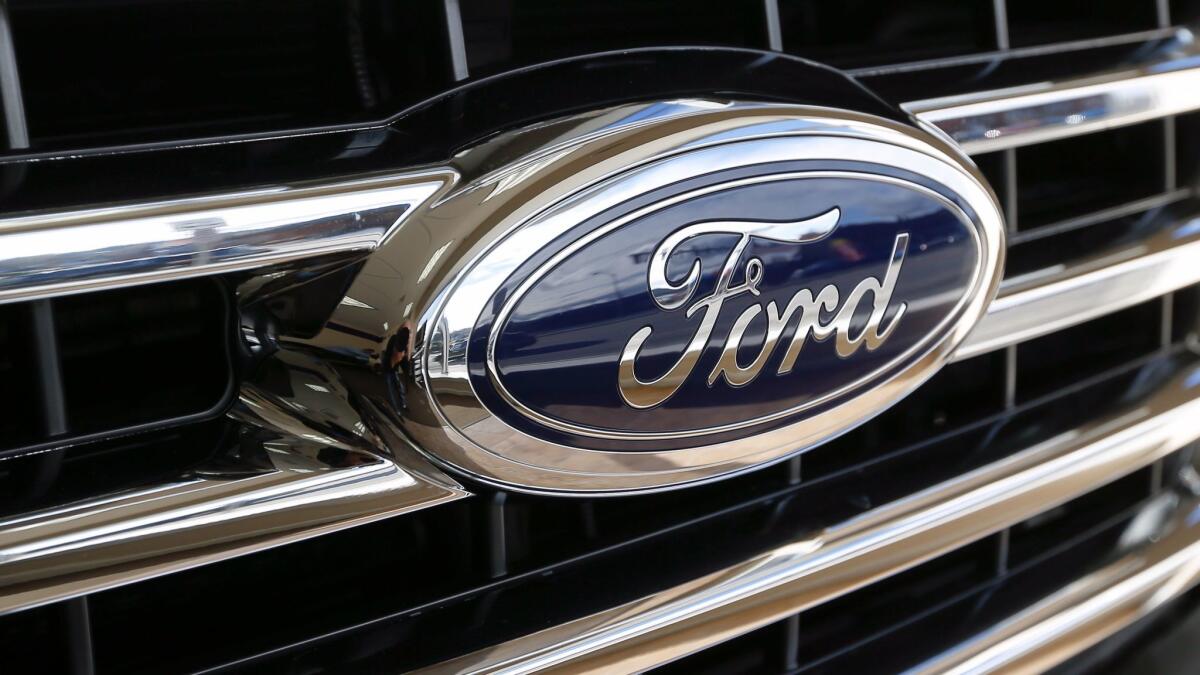 The grill of a 2015 Ford F-150 XLT on display in a showroom on Nov. 19, 2015.