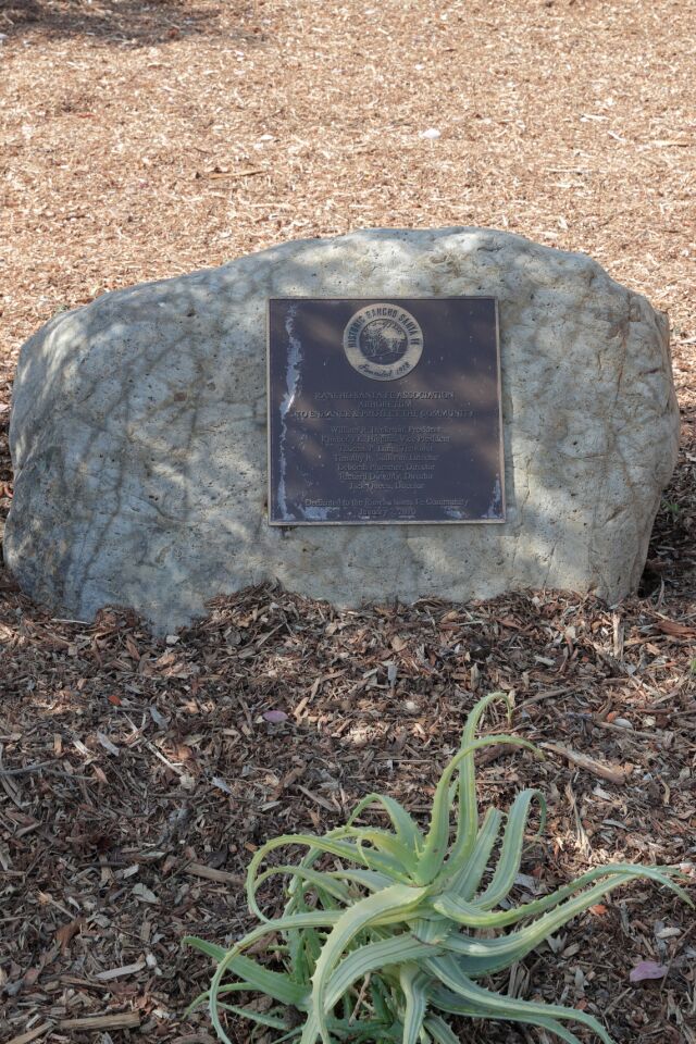 A plaque dedicates the RSF Arboretum to enhance and protect the community