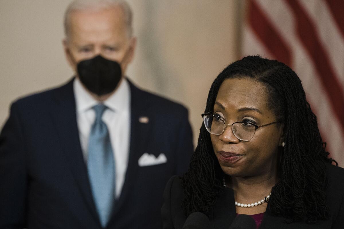 Judge Ketanji Brown Jackson delivers remarks on her nomination, with President Biden in the background