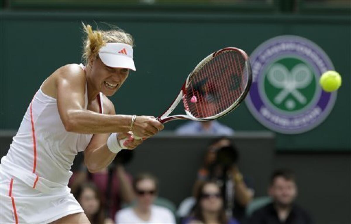 Angelique Kerber of Germany plays a shot to Agnieszka Radwanska of Poland during a semifinals match at the All England Lawn Tennis Championships at Wimbledon, England, Thursday, July 5, 2012. (AP Photo/Anja Niedringhaus)