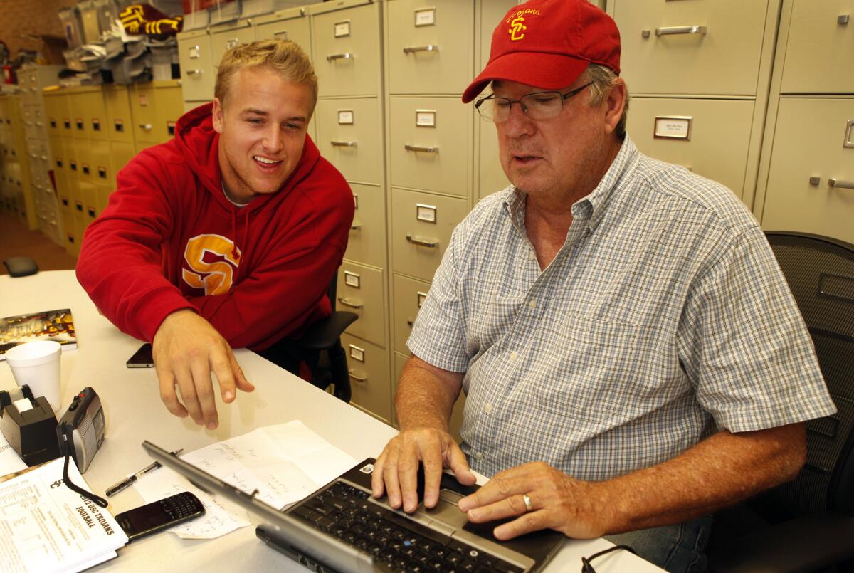 USC quarterback Matt Barkley teaches Times sports columnist T. J. Simers how to set up a Twitter account in 2012.