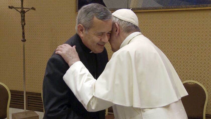 Juan Barros, bishop of Osorno, greets Pope Francis during a meeting at the Vatican on May 17.