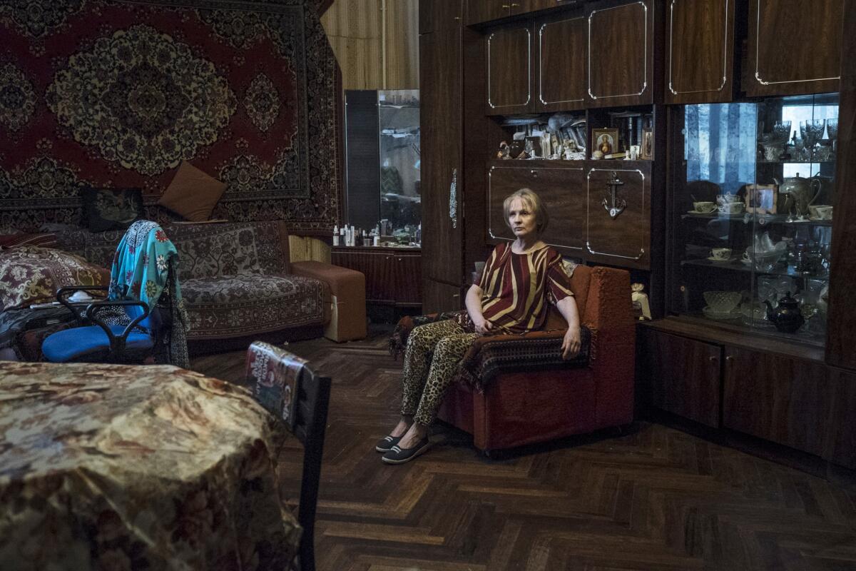 Marina Maslova in the room where she was born and has spent her entire life with her family in St. Petersburg. (Vasiliy Kolotilov / For The Times)