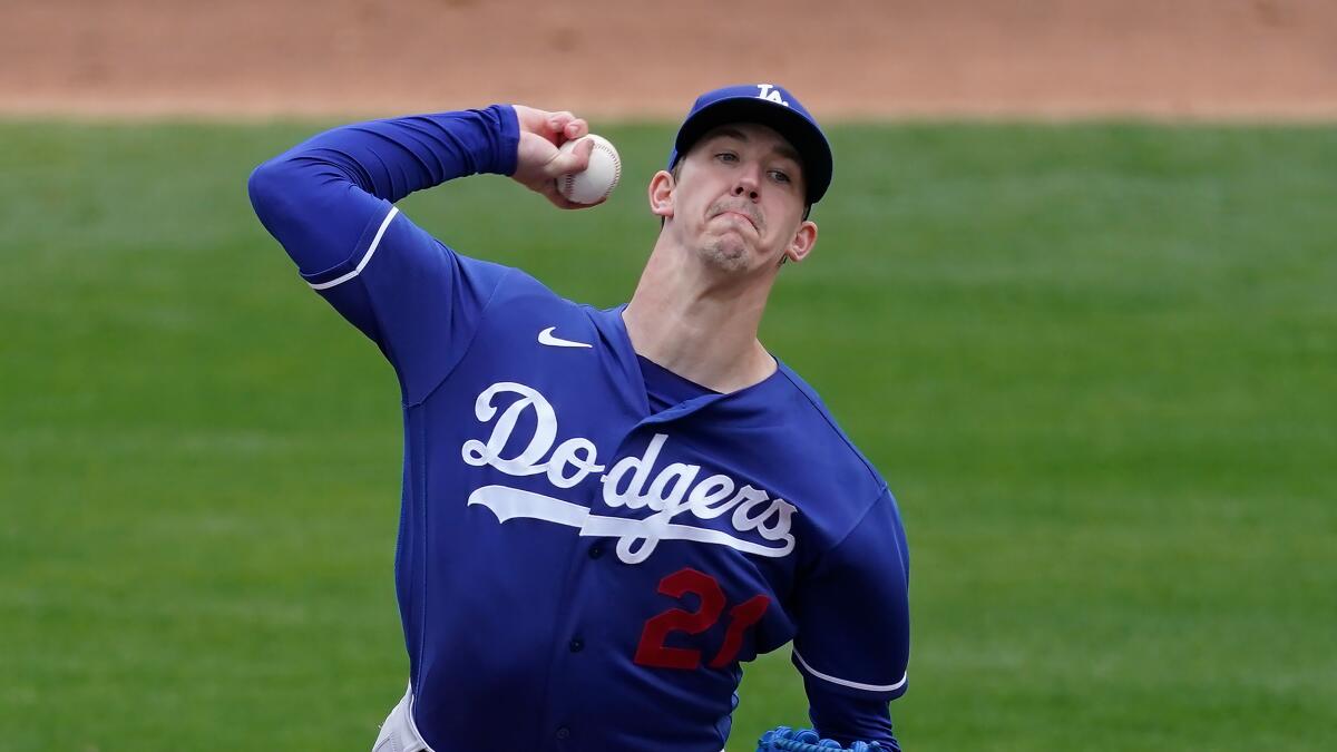 Dodgers starting pitcher Walker Buehler delivers during a game against the Milwaukee Brewers on Tuesday.