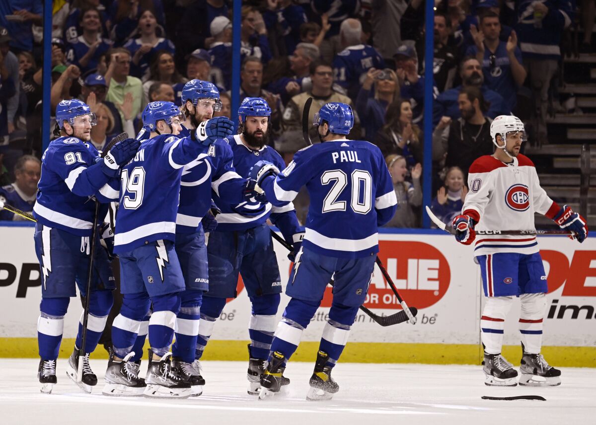Tampa Bay Lightning celebrate defenseman Victor Hedman's (77) goal during the first period of an NHL hockey game against the Montreal Canadiens, Saturday, March 18, 2023, in Tampa, Fla. (AP Photo/Jason Behnken)