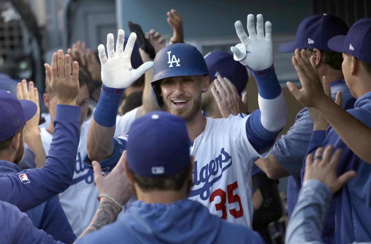 Cody Bellinger celebrates with his Dodgers teammates.