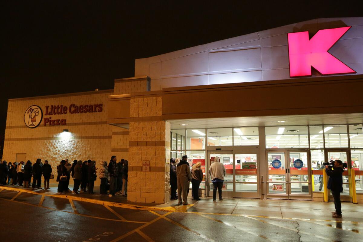 Customers line up outside a Chicago-area Kmart store before Black Friday 2015.