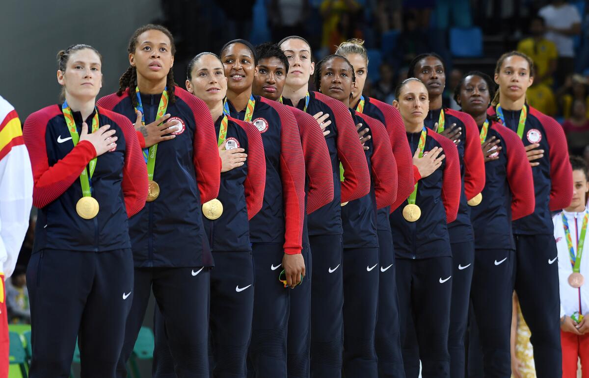 The U.S. women's basketball team listens to the national anthem after winning the gold medal at the Rio 2016 Olympics on Aug. 20.