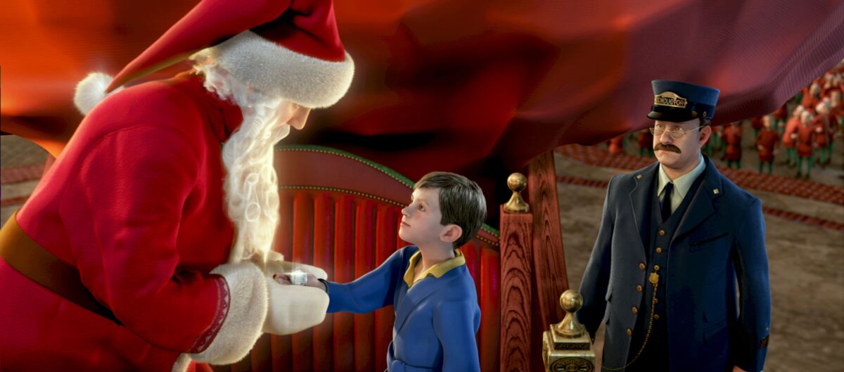 A boy meets Santa as a train conductor looks on in a scene from the animated holiday movie ”The Polar Express." 
