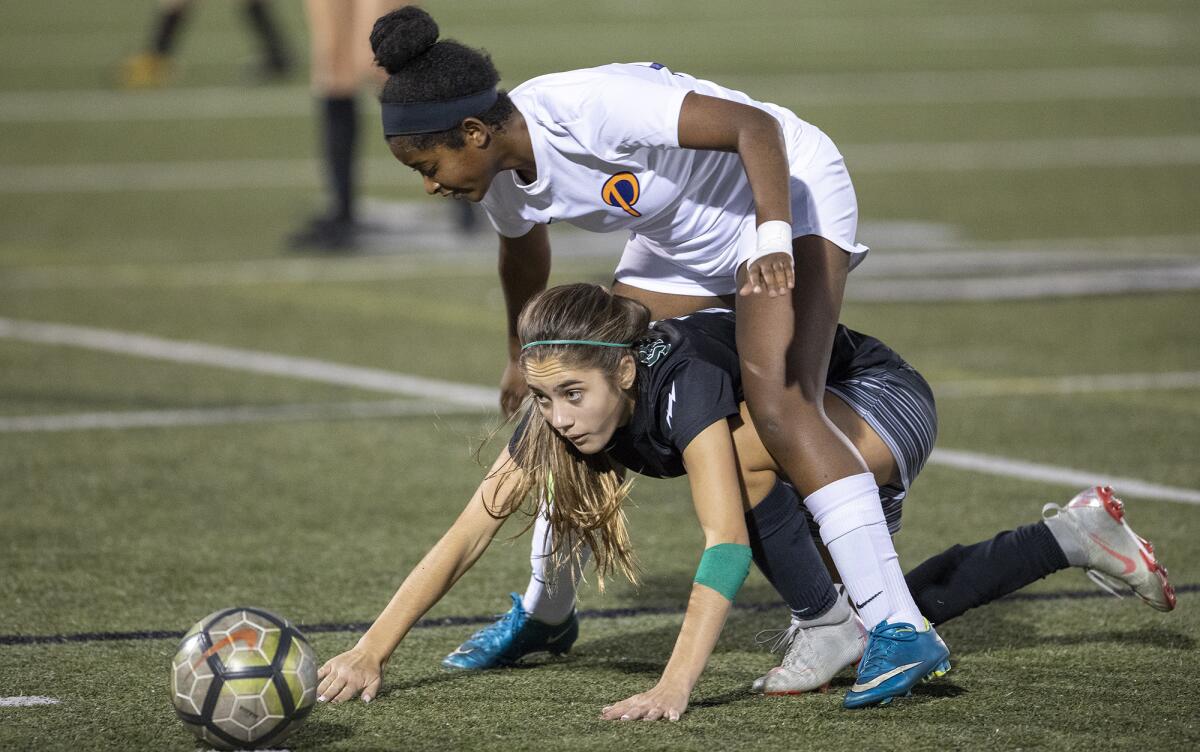 Sage Hill's Lexi Van Den Bosch, bottom, seeks out the ball during a San Joaquin League match against Pacifica Christian Orange County on Jan. 24, 2019.