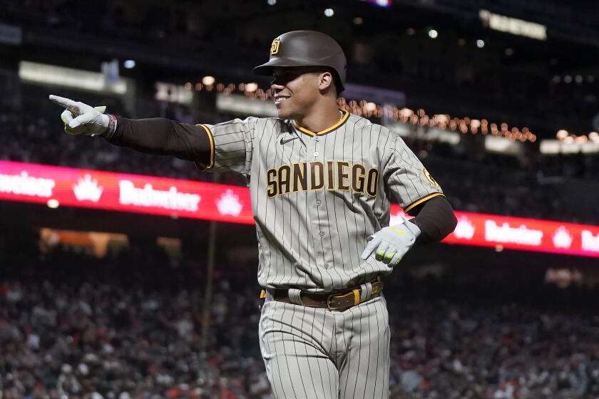 San Diego Padres' Juan Soto gestures after hitting a two-run home run during the seventh inning of a baseball game against the San Francisco Giants in San Francisco, Tuesday, Sept. 26, 2023. (AP Photo/Jeff Chiu)