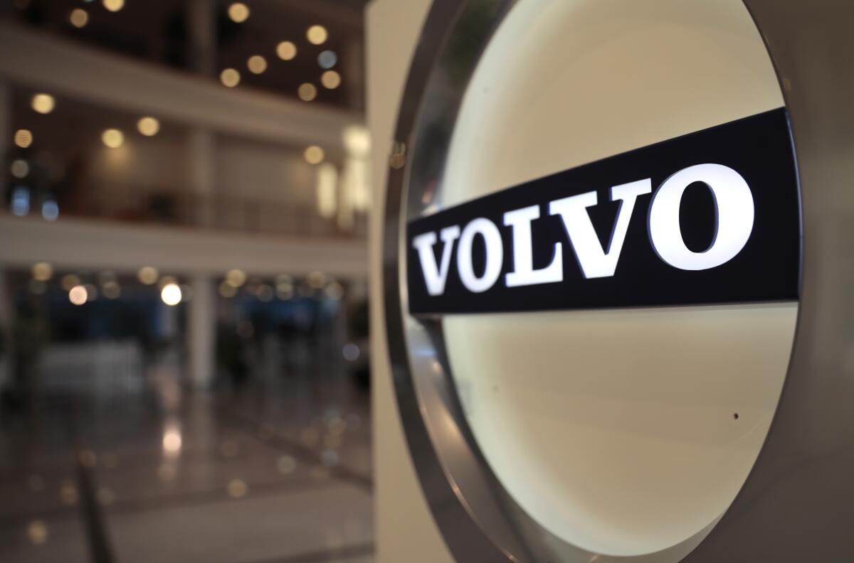 FILE - This Feb. 6, 2020, file photo shows the Volvo logo in the lobby of the Volvo corporate headquarters in Brussels. Swedish automaker Volvo said Monday, Oct. 4,2021 it plans to raise at least 25 billion kroner ($2.9 billion) by selling shares to fund its electric vehicle transformation strategy. Volvo and its parent company, Chinese carmaker Geely, have applied to hold an initial public offering on the Nasdaq Stockholm. (AP Photo/Virginia Mayo, File)