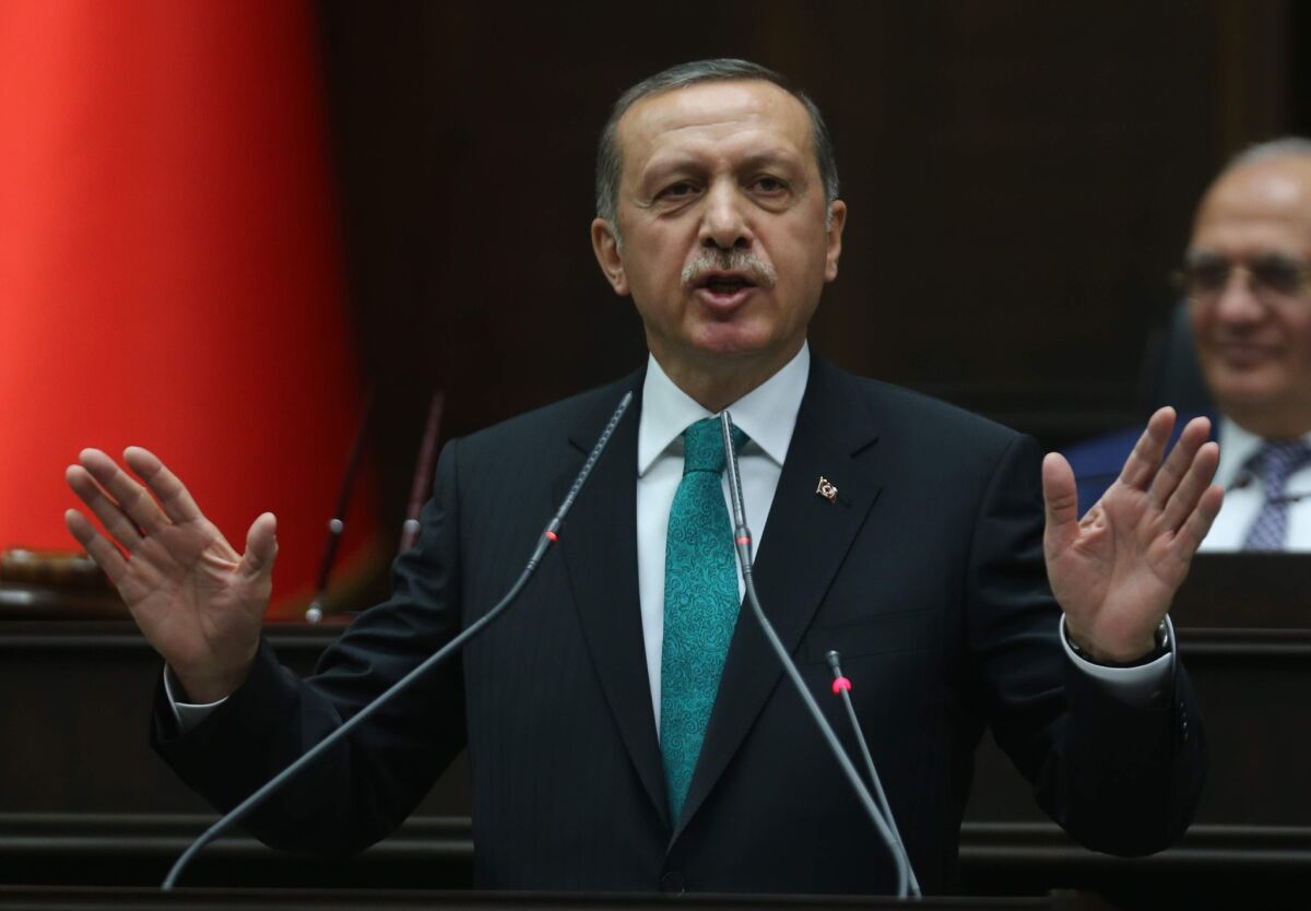 Turkish Prime Minister Recep Tayyip Erdogan delivers a speech to the members of the parliament in Ankara.