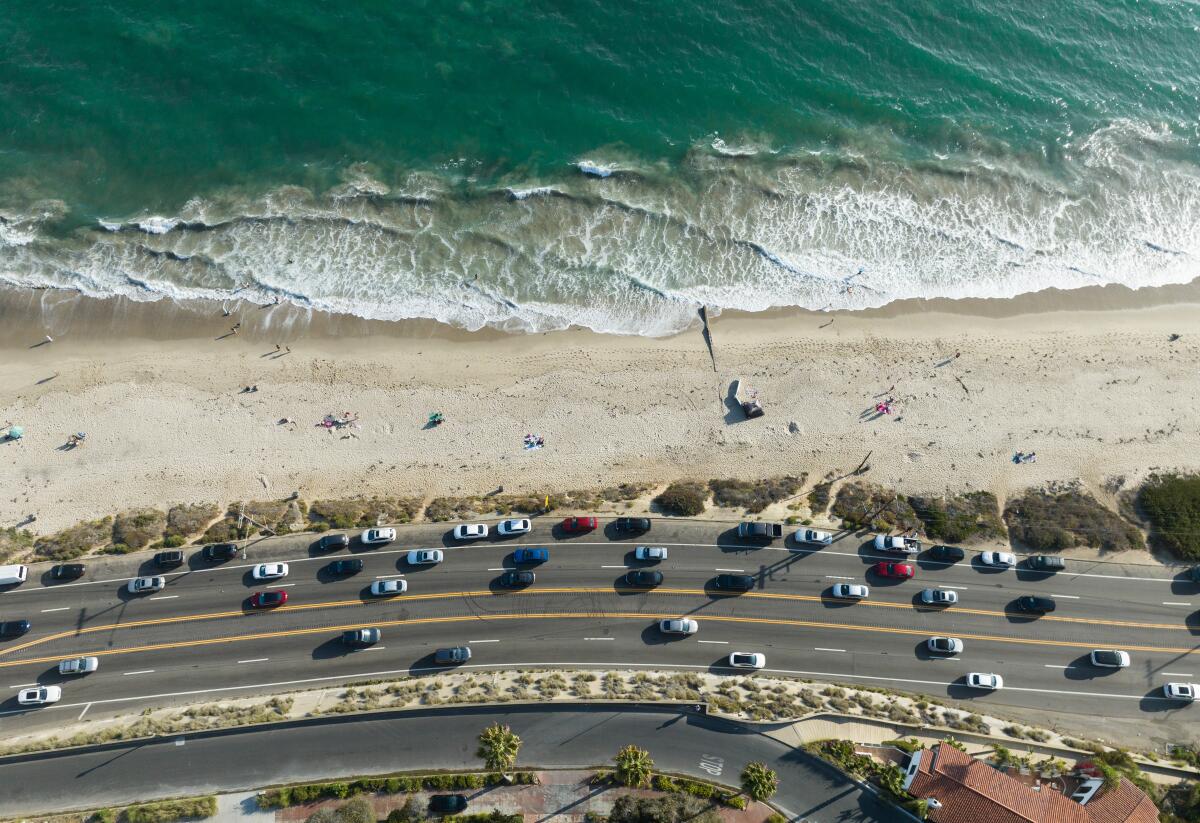 Afternoon traffic flows along Pacific Coast Highway in Pacific Palisades near Will Rogers State Beach on Aug. 18.