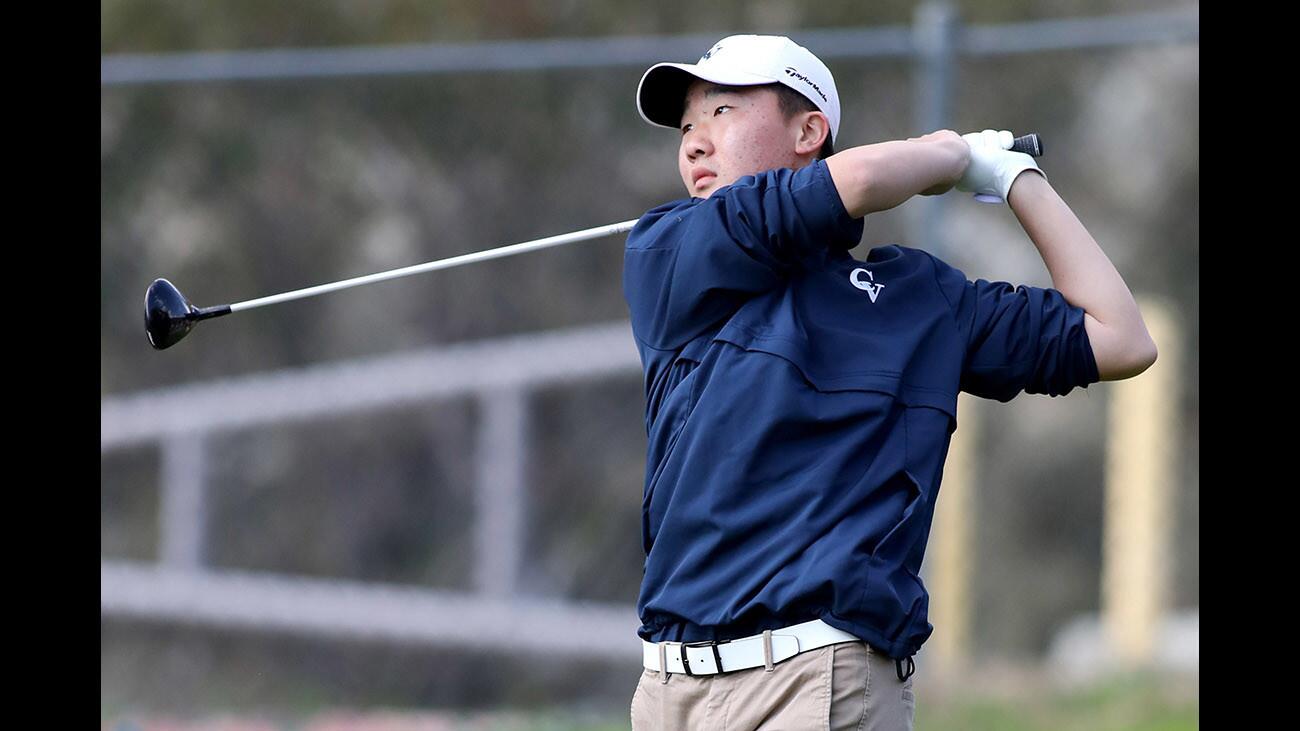 Crescenta Valley High School golfer Peter Kim tees off during Pacific League competition at DeBell Golf Course in Burbank on Thursday, March 1, 2018.