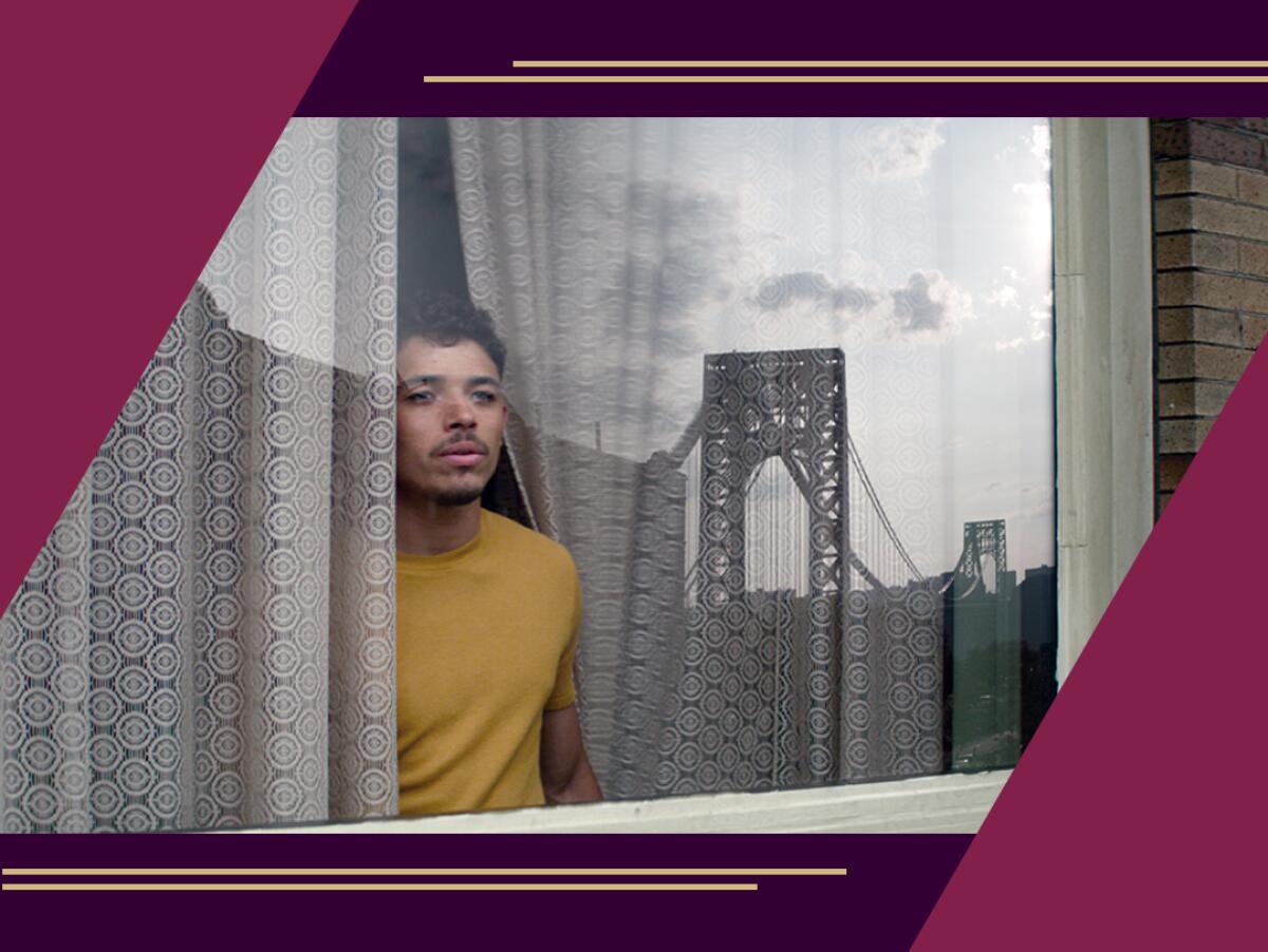 Anthony Ramos looks out a window.