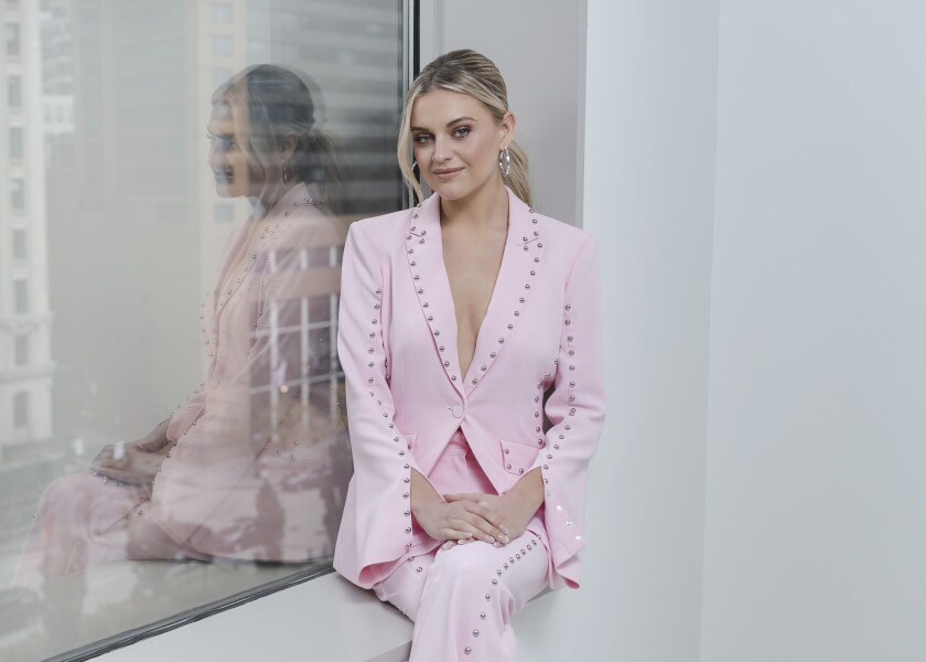 CAPTION CORRECTS FIRST NAME - Kelsea Ballerini poses for a portrait on Monday, Nov. 15, 2021, in New York. Ballerini released a book of poetry, “Feel Your Way Through." (Photo by Christopher Smith/Invision/AP)