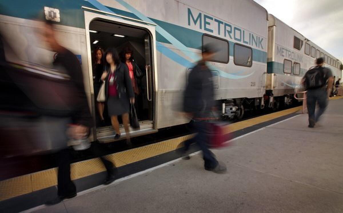 Incoming Metrolink passengers exit a train at Union Station in downtown Los Angeles.