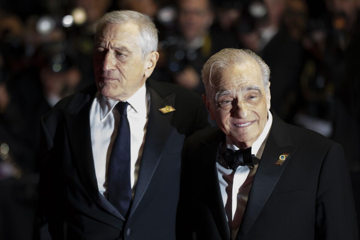 Robert De Niro and Martin Scorsese in tuxedos.