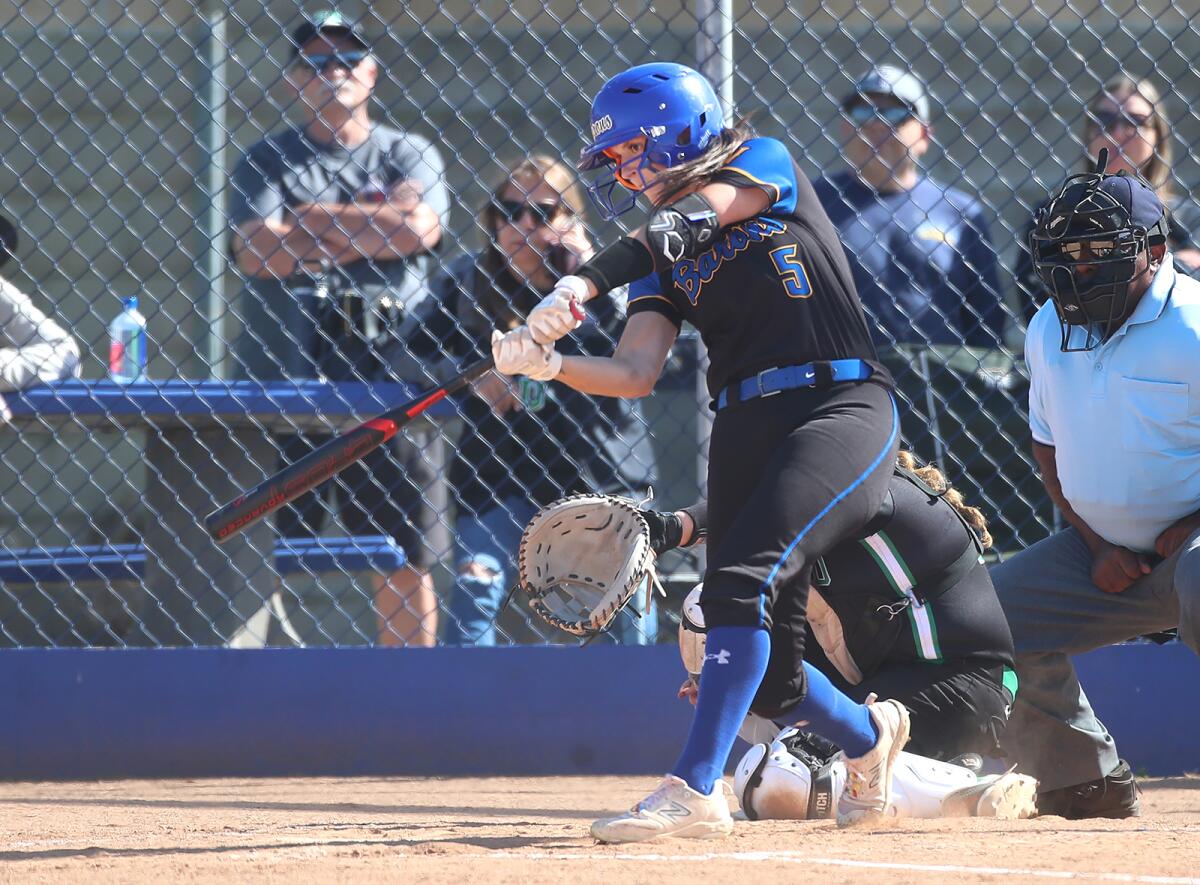 Taylor Reynolds (5) of Fountain Valley hits a single while advancing a runner against Upland on Tuesday.