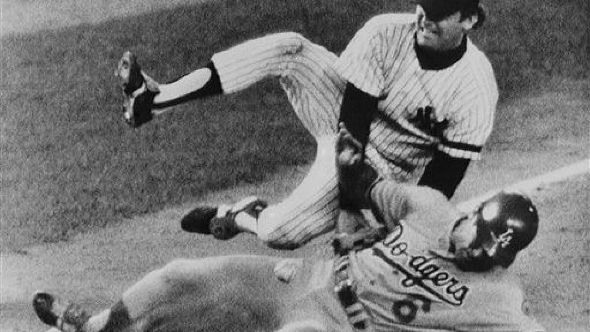 Steve Garvey slides into third as Graig Nettles drops the ball in 1981 World Series.