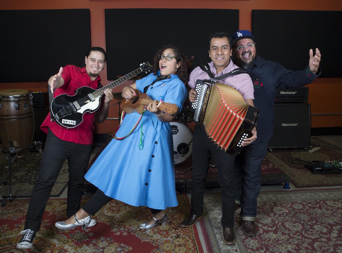 La Santa Cecilia members from left: bassist Alex Bendaña, vocalist Marisol Hernandez, accordionist Jose Carlos and percussionist Miguel Ramirez.