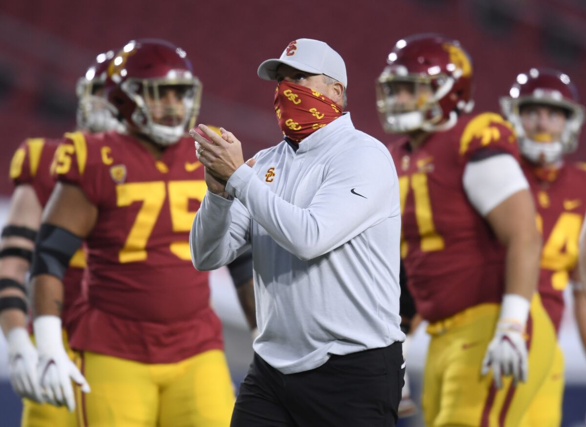 USC coach Clay Helton looks on before a loss to Oregon in the Pac-12 title game at the Coliseum.