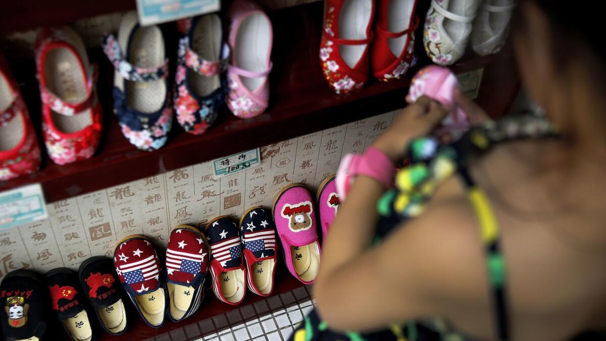 Chinese-made children's shoes are on display at a shop in Beijing.