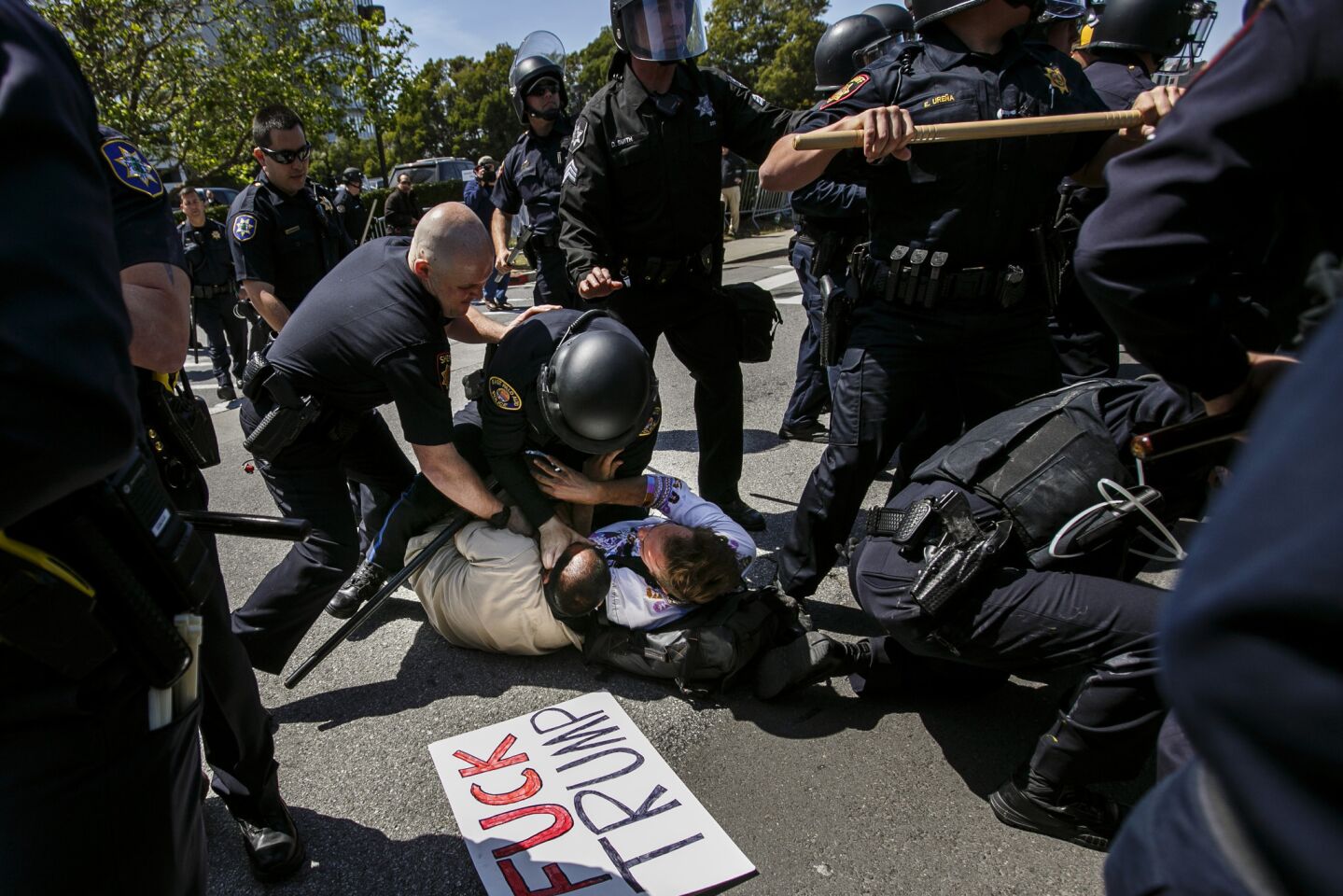 Protesters clash with police outside the hotel hosting the California Republican Convention in Burlingame on April 29, 2016.