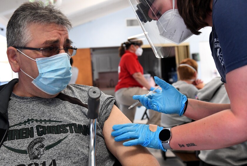 A man receives a COVID-19 vaccine.