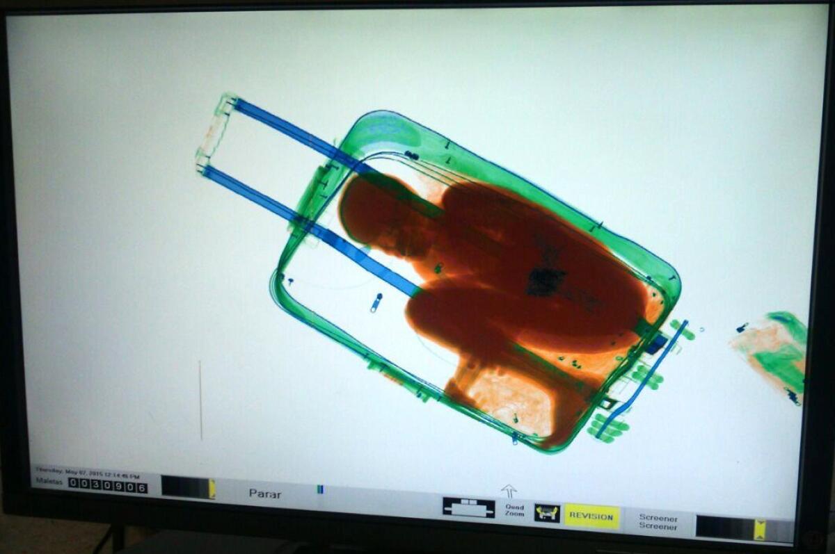 A file picture provided by Spanish Guardia Civil on May 8 shows an X-ray image of 8-year-old Ivorian boy Adou Ouattara hidden in a suitcase.