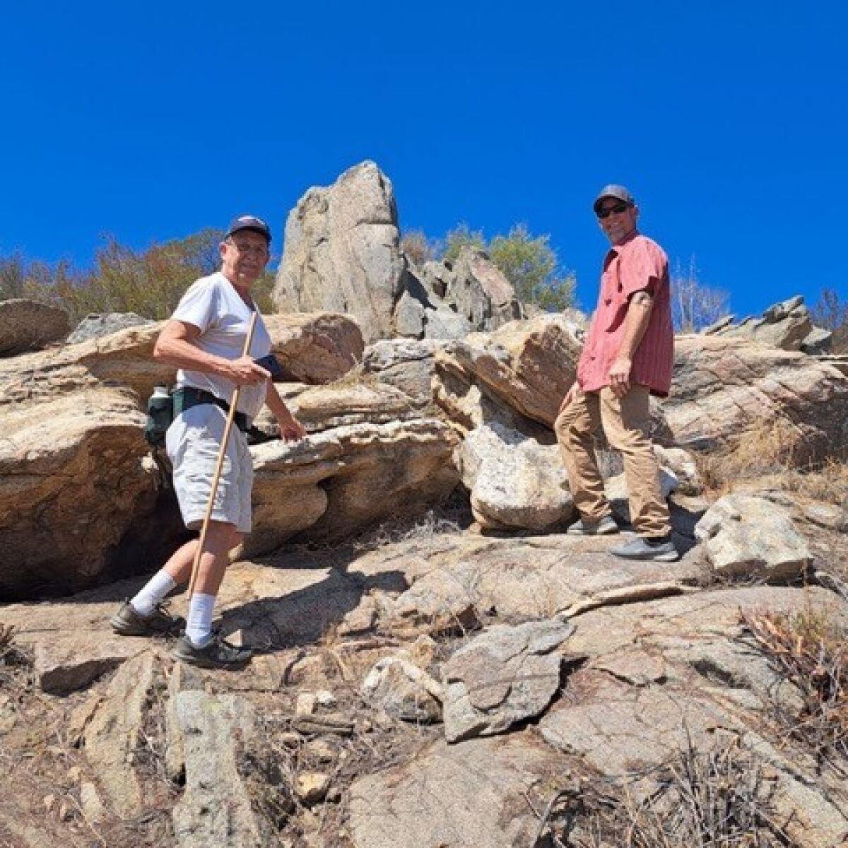 Joe Cahak, left, points out some unusual rocks to Ramona Ranch Winery owner Micole Moore.