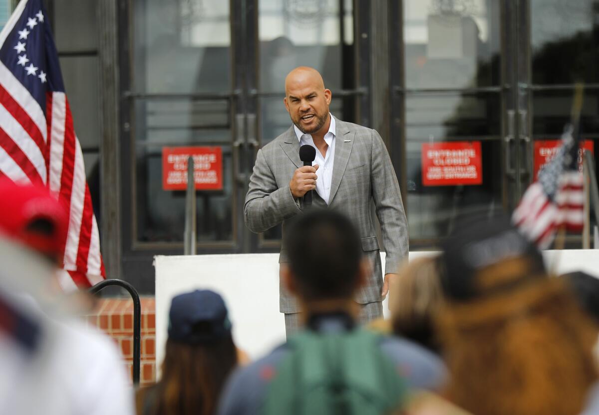 Mixed martial arts fighter Tito Ortiz speaks at a Recall Gavin Newsom rally 