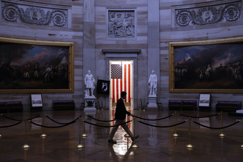 WASHINGTON, DC - MARCH 24: A man walks through the U.S. Capitol Rotunda, empty of tourists as only essential staff and journalists are allowed to work during the coronavirus pandemic March 24, 2020 in Washington, DC. After days of tense negotiations -- and Democrats twice blocking the nearly $2 trillion package -- the Senate and Treasury Department appear to have reached important compromises on legislation to shore up the economy during the COVID-19 pandemic. (Photo by Chip Somodevilla/Getty Images)