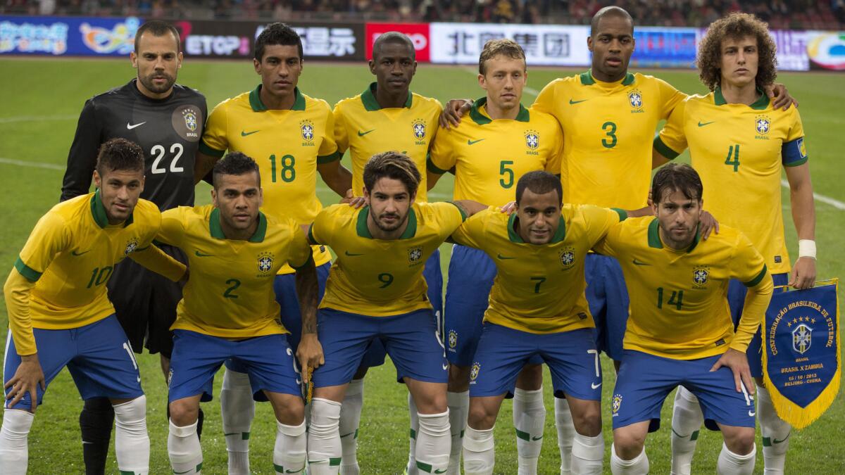 Players on Brazil's national team pose prior to a match against Zambia in China on Oct. 15. Brazil, the host nation for the 2014 World Cup, is hoping to win its sixth World Cup title.