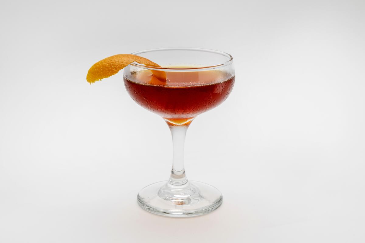 A mixed drink lies on a table