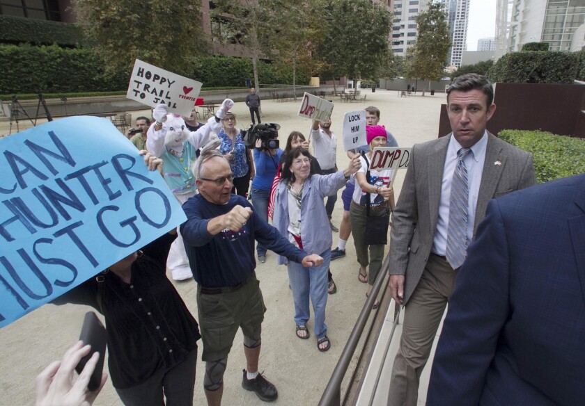 Protesters confronted Rep. Duncan D. Hunter, R-Alpine, recently as he went to the new courthouse building in downtown San Diego.