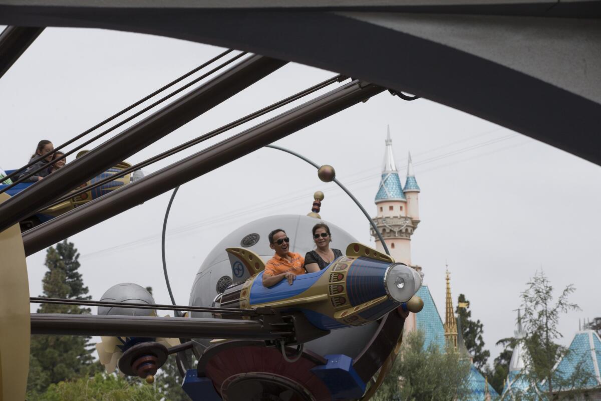 Riders on Disneyland's Astro Orbitor