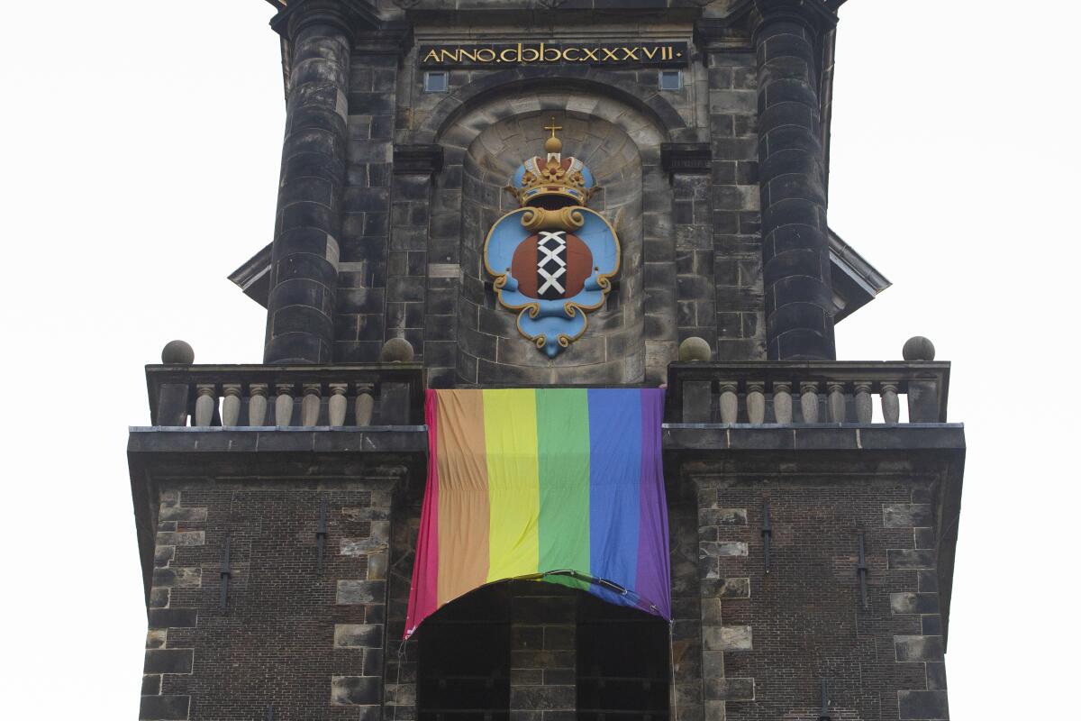 Rainbow flag on bell tower of Amsterdam church