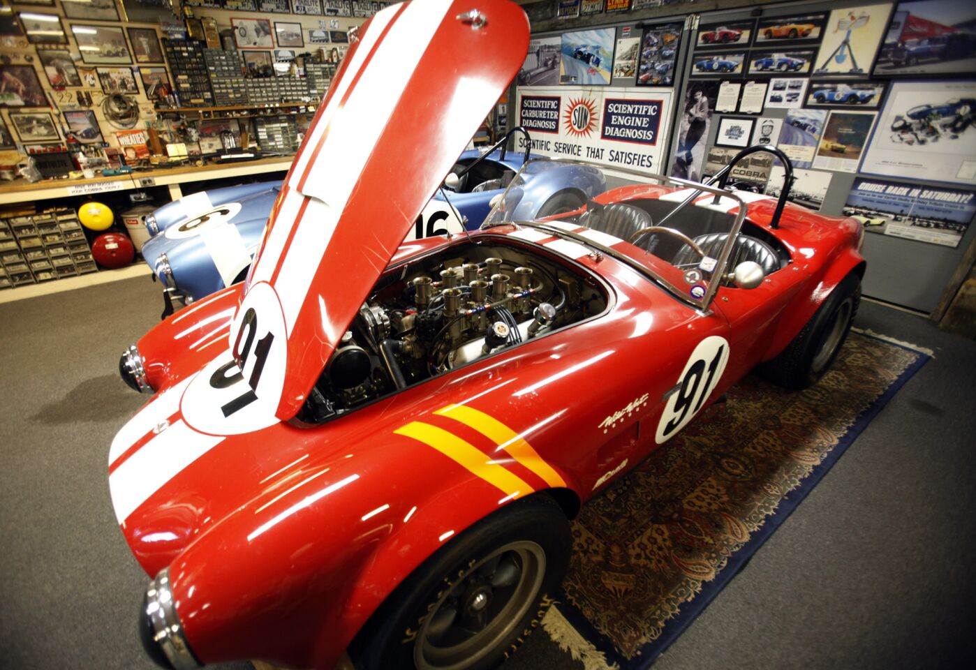 Lynn Park keeps his Cobras in his garage in La Cañada Flintridge. He and his sons plan to race race three of them at the Pebble Beach, Calif., event.