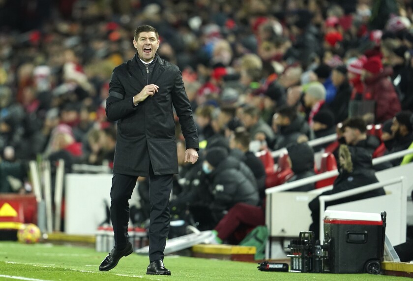 Aston Villa's head coach Steven Gerrard shouts to his players from the sidelines during the English Premier League soccer match between Liverpool and Aston Villa at Anfield stadium in Liverpool, Saturday, Dec. 11, 2021. (AP Photo/Jon Super)