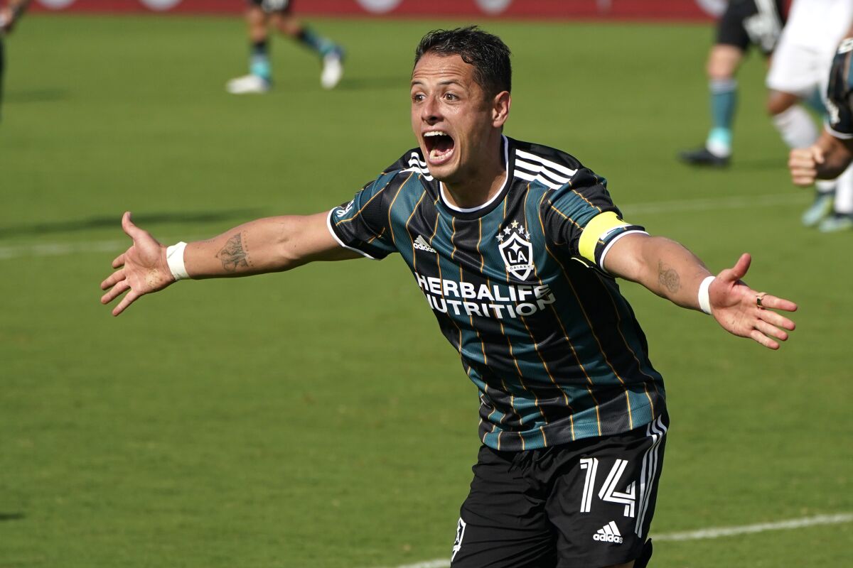 Galaxy forward Javier Hernandez (14) reacts after scoring a goal during the second half.